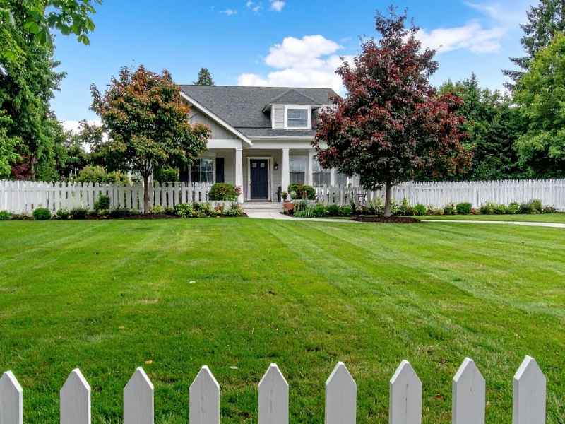 Boundary line survey showing a residential fence and property boundary considerations for a home in Alabaster Alabama.